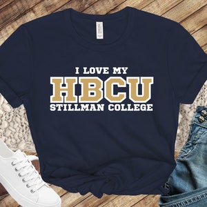 May include: Navy blue t-shirt with white text that reads "I love my HBCU Stillman College" in gold letters.