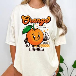 Bonita camiseta naranja con estampado de frutas retro, camiseta gráfica estética Y2K, top de dibujos animados kawaii para mujer, regalo