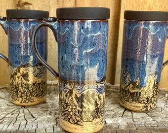 Discounted Seconds Handmade Ceramic Travel Mug: Pine Tree Forest, Mountain, Clouds, Blue Glaze Silicone Lid