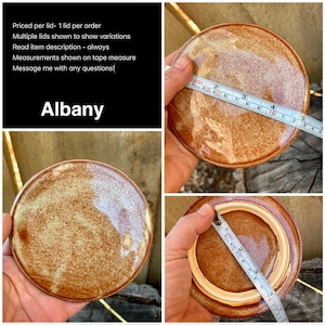 May include: A round ceramic lid with a glossy, mottled brown and cream glaze. A measuring tape shows the top diameter is approximately 4 inches and the inner rim diameter is approximately 3 inches. The text Albany is displayed on a black background.