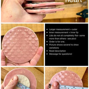 May include: A light pink ceramic lid featuring a textured heart pattern. The circular lid has an inner lip and measures approximately 3.5 inches in diameter as shown by a measuring tape. The surface has a glossy finish with a repeating heart design.