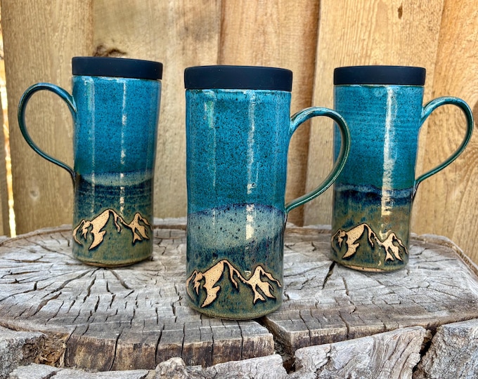 Featured listing image: Handmade Teal Mountain Ceramic Travel Mug with Silicone Lid - Cup Holder Friendly