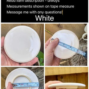 May include: A round white ceramic lid with a smooth finish. The lid features a very slight curve. A measuring tape is shown across the lid, indicating a diameter of approximately 3.25 inches. The lid has a circular raised rim on the underside.