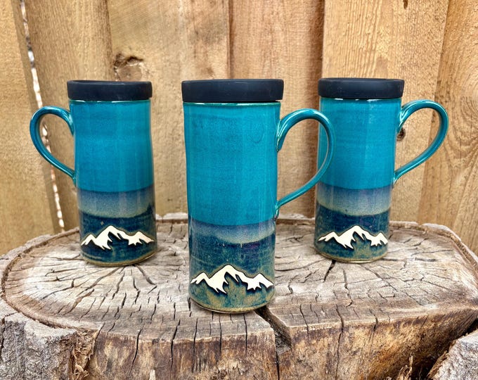 Featured listing image: Handmade Teal Mountain Ceramic Travel Mug with Silicone Lid - Cup Holder Friendly