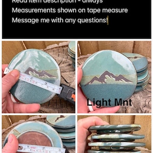 May include: Round ceramic lids with a light mint green glaze and a dark mountain range graphic. A measuring tape shows a diameter of approximately 3.5 inches. The text 'Light Mnt' is visible on one lid. The underside is unglazed brown clay.