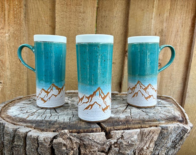 Featured listing image: Handmade Turquoise and White Mountain Ceramic Travel Mug with Silicone Lid - Cup Holder Friendly