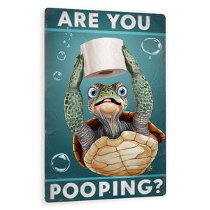 May include: A green turtle with a surprised expression holds a roll of toilet paper above its head. The background is blue with white bubbles and the text "Are you pooping?" in white letters.