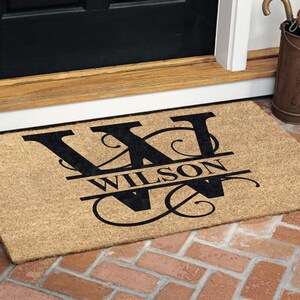 Personalized coir doormat with a custom monogram, ideal for housewarming gifts or special occasions. Made from natural coir fibers, this durable and eco-friendly mat adds a stylish and practical touch to any home entrance.