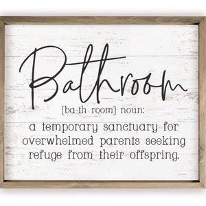 May include: A white wooden sign with a black inscription that reads "Bathroom [ba-th room] noun: a temporary sanctuary for overwhelmed parents seeking refuge from their offspring."
