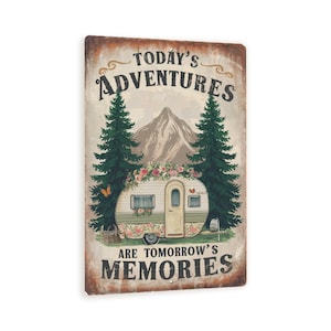 May include: A rectangular metal sign with a vintage design. The sign features a camper with floral accents, two pine trees, and a mountain backdrop. Text reads "Today's Adventures Are Tomorrow's Memories."