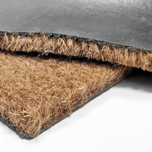 Durable coir welcome mat with a personalized monogram, ideal for housewarming gifts or special occasions. This eco-friendly doormat is made from natural coconut fibers and can be customized with your chosen initial or name.