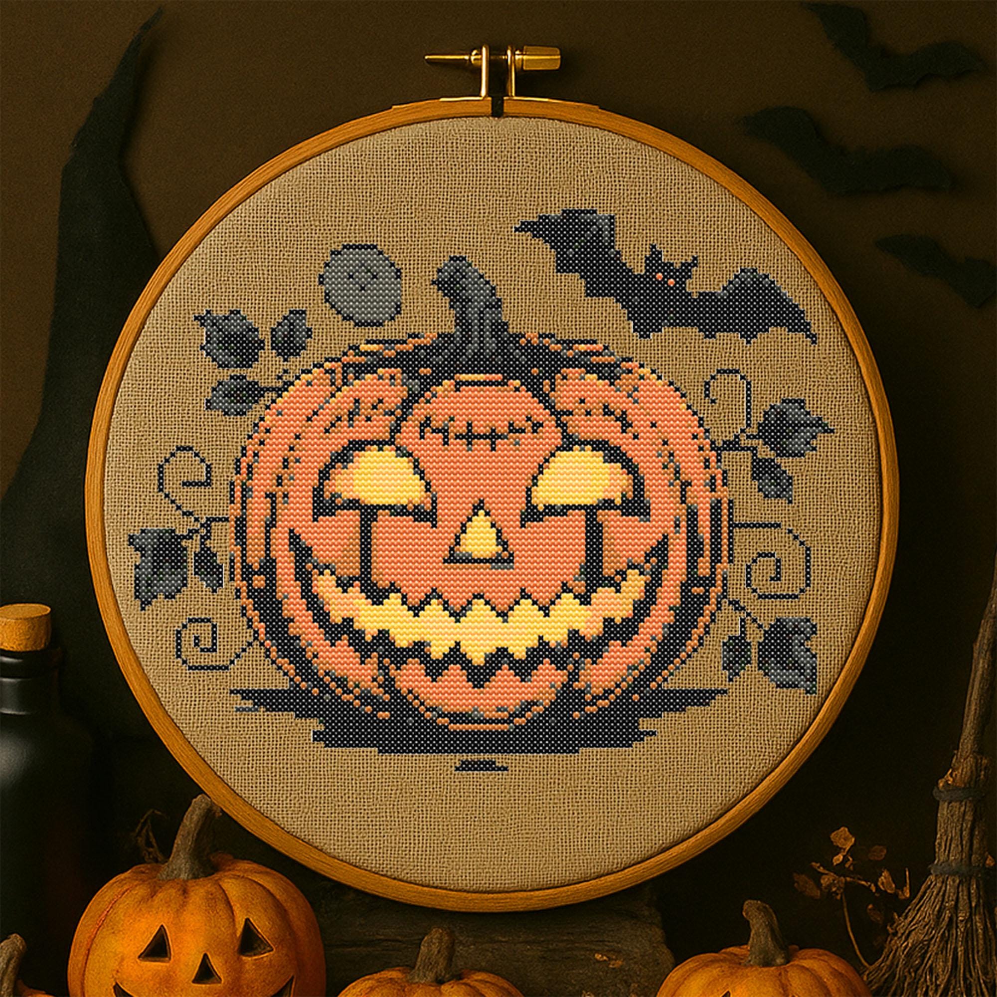 不気味なカボチャのクロスステッチパターン ハロウィンの光るカボチャ