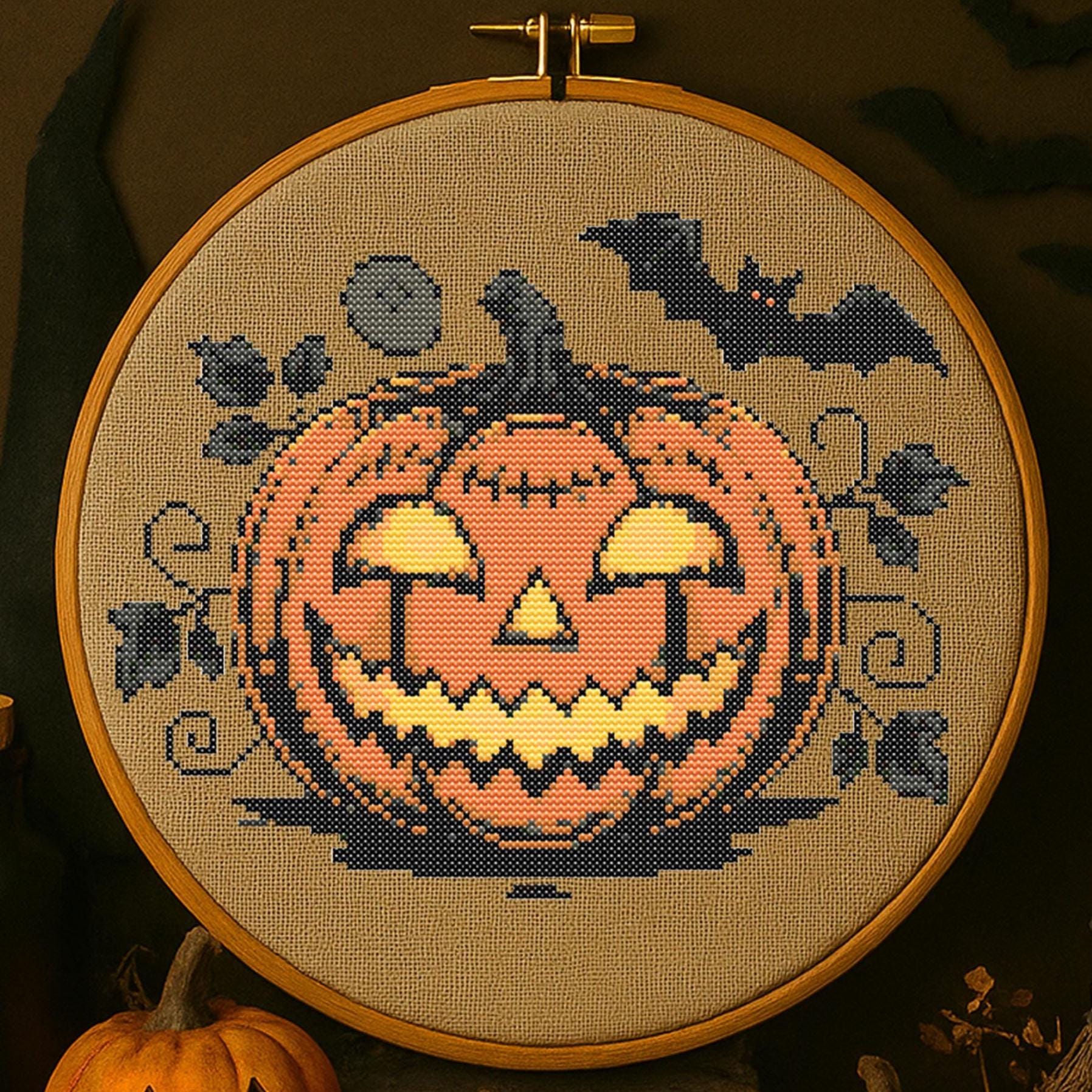 不気味なカボチャのクロスステッチパターン ハロウィンの光るカボチャ