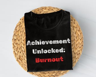 Camiseta unisex con frase "Logro desbloqueado, agotamiento", humor de jugador, agotamiento laboral, cita divertida