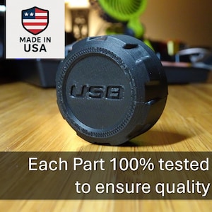 May include: A black USB connector with a textured surface and the word "USB" printed on it. Each part is 100% tested to ensure quality.