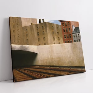 Op de afbeelding: Een canvas print van een stedelijke scène met een tunnel, spoorrails en gebouwen. Het kunstwerk toont een beige muur, een donkere tunnelingang en spoorrails op de voorgrond. Gebouwen met ramen zijn zichtbaar op de achtergrond.