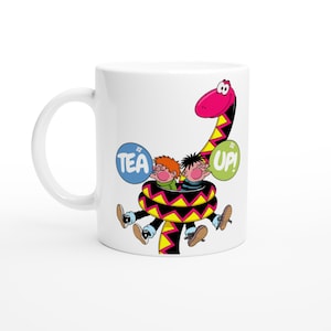 May include: White ceramic mug with a cartoon design of two children inside a snake. The snake is pink, black, and yellow. Text bubbles say "TEA UP!"