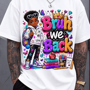 May include: A white t-shirt featuring a graphic of a young person wearing a hoodie, jeans, and sneakers, carrying a backpack. The text reads "Bruh we Back" with a crown, books labeled "Stay Focused," "Dream Big," "Be Yourself," and school supplies.