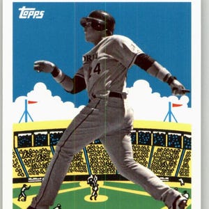 May include: A baseball card featuring Miguel Cabrera of the Florida Marlins. The card shows Cabrera in a baseball uniform, mid-stride on a green field, with a stadium and crowd in the background. The Topps logo is in the upper left corner.