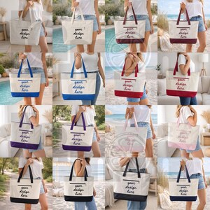 K&ouml;nnte beinhalten: Eine Sammlung von Canvas-Tragetaschen in verschiedenen Farben, darunter Wei&szlig;, Burgunderrot, Blau und Rosa. Jede Tasche hat eine Rei&szlig;verschlusstasche und den Text "your design here" in handschriftlichem Stil. Die Taschen haben farblich abgesetzte Griffe und Unterteile.