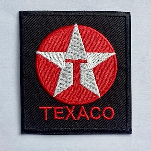 May include: Black square patch with a red circle and a white star in the center. The star has a red "T" in the middle. The word "TEXACO" is embroidered in red below the circle.