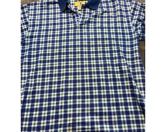 Polo de algodón de manga corta a cuadros azules para hombre con logo grande bordado de Duck Head.