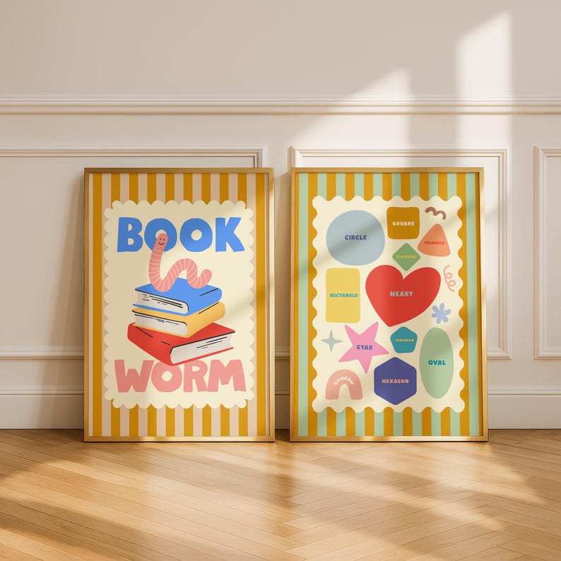 May include: Two framed art prints. One features a stack of books with a worm and the words "BOOK WORM". The other print displays various shapes, including a heart, star, and hexagon, with labels like "CIRCLE" and "OVAL". Both have gold frames.