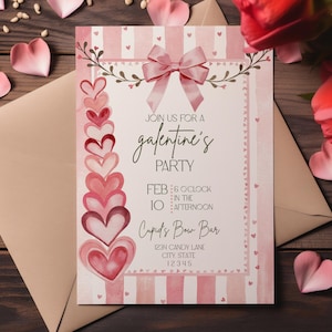 May include: A pink Galentine's Party invitation with a bow, hearts, and text. The invitation includes the text "Join us for a Galentine's Party" and event details. The invitation is on a wooden surface with heart-shaped decorations.