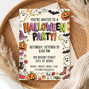 May include: A rectangular Halloween party invitation card featuring colorful text that reads You're Invited To A Halloween Party, Saturday, October 31, 6:00 PM, 123 Spooky Street, City, ST 12345, Tricks, Treats, Music, Fun, Costumes Encouraged.