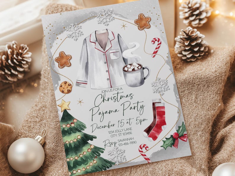 May include: A Christmas Pajama Party invitation with watercolor illustrations. The design features a pajama top, a mug of hot cocoa, gingerbread cookies, a Christmas tree, and a stocking. The invitation includes the text "Join us for a Christmas Pajama Party".