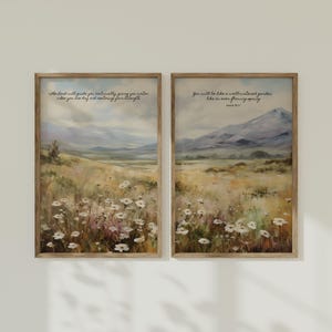 May include: Two framed prints with watercolor paintings of a field of wildflowers. The top print has the text "The Lord will guide you continually, giving you water when you are dry and restoring your strength." The bottom print has the text "You will be like a well-watered garden, like an ever-flowing spring. Isaiah 58:11"