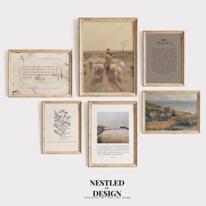 May include: A collection of framed art prints in a neutral color palette. The prints include a pastoral scene with sheep, botanical illustrations, landscape paintings, and inspirational text. The frames are a light wood color, creating a cohesive gallery wall.