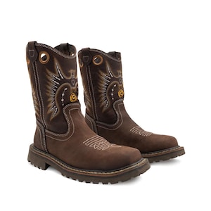 May include: A pair of brown leather cowboy boots with decorative stitching in white and gold. The boots have a round toe, a mid-calf shaft, and a thick, rugged sole. The boots feature a decorative design on the shaft and a logo on the side.