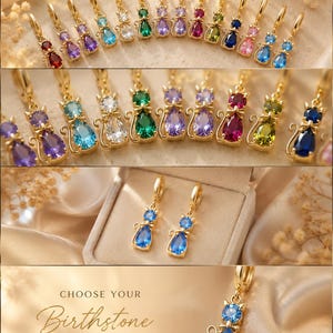 May include: A collection of gold-tone hoop earrings featuring cat-shaped pendants with colorful teardrop and round gemstone accents. The jewelry pieces are displayed in various colors including blue, green, purple, red, and clear. Text reads: CHOOSE YOUR Birthstone.