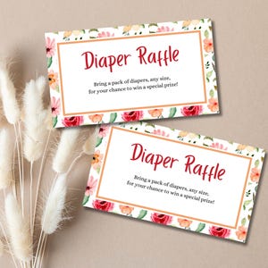 May include: Two white cards with a floral border and the text "Diaper Raffle" in red. The text below reads "Bring a pack of diapers, any size, for your chance to win a special prize!"