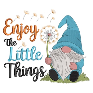 May include: A whimsical illustration of a garden gnome holding a dandelion, with the text "Enjoy The Little Things." The gnome wears a blue hat and has a long white beard. The design includes orange, blue, and black lettering.
