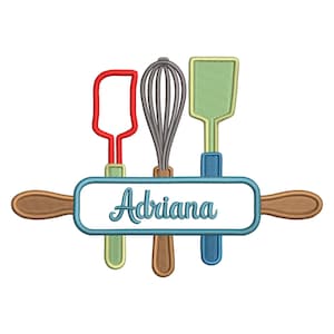 May include: A colorful embroidered design featuring kitchen tools: a red spatula, a gray whisk, and a green spatula. The tools are arranged above a rolling pin with the name "Adriana" in cursive script. The design is perfect for kitchen decor.