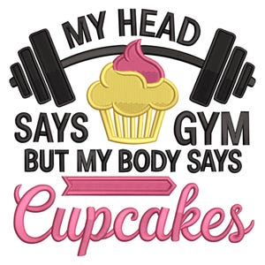 May include: A graphic design with the text "MY HEAD SAYS GYM BUT MY BODY SAYS Cupcakes". The design includes a barbell, a cupcake with pink icing, and a pink arrow.
