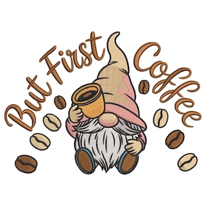 May include: Embroidered design featuring a gnome holding a coffee cup, surrounded by coffee beans. The text "But First Coffee" is arched above the gnome. The gnome wears a pink and tan hat and has a white beard. The design is on a white background.