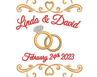 May include: Embroidered design with the names "Linda & David" in red script, featuring two gold wedding rings and the date "February 24th 2023." Gold filigree and heart accents frame the text and rings, creating a celebratory theme.