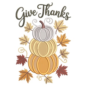 May include: An embroidered design featuring three stacked pumpkins in shades of white, yellow, and orange, surrounded by fall leaves. The words "Give Thanks" are written in a script font above the pumpkins, perfect for autumn decor.