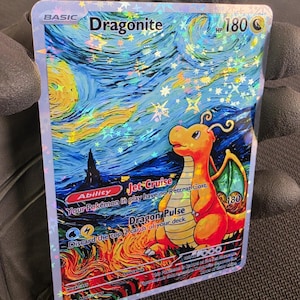 May include: A holographic Dragonite trading card featuring a Starry Night-inspired background with swirling blue and yellow patterns. The card displays the name Dragonite, 180 HP, the Jet Cruise ability, and the Dragon Pulse attack text clearly.