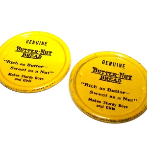 2 UNIQUE Round Vintage Advertising Butter Nut Bread Tin Toy CLICKER Graphic Font Lithograph Noise Maker