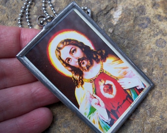 Kitsch Vintage 1980's Large Jesus Pendant on the back of Mexican Carta Blanca Beer Tin