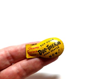 Juguete publicitario de hojalata litografiada vintage – Calentador doméstico Duo Therm