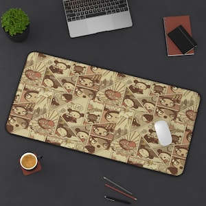 May include: A rectangular desk mat featuring a comic strip design with a repeating pattern of a cartoon character and the words "Love Bomb." The color palette includes beige, brown, and red accents.