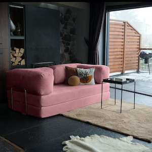 Livingroom teddy couch displayed with layered pillows, creating a warm and inviting centerpiece for modern homes.