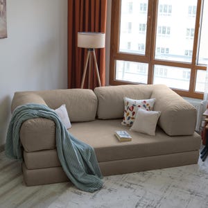 Teddy luxury corner sofa styled with plush velvet cushions, offering cozy seating and timeless elegance for modern livingrooms.