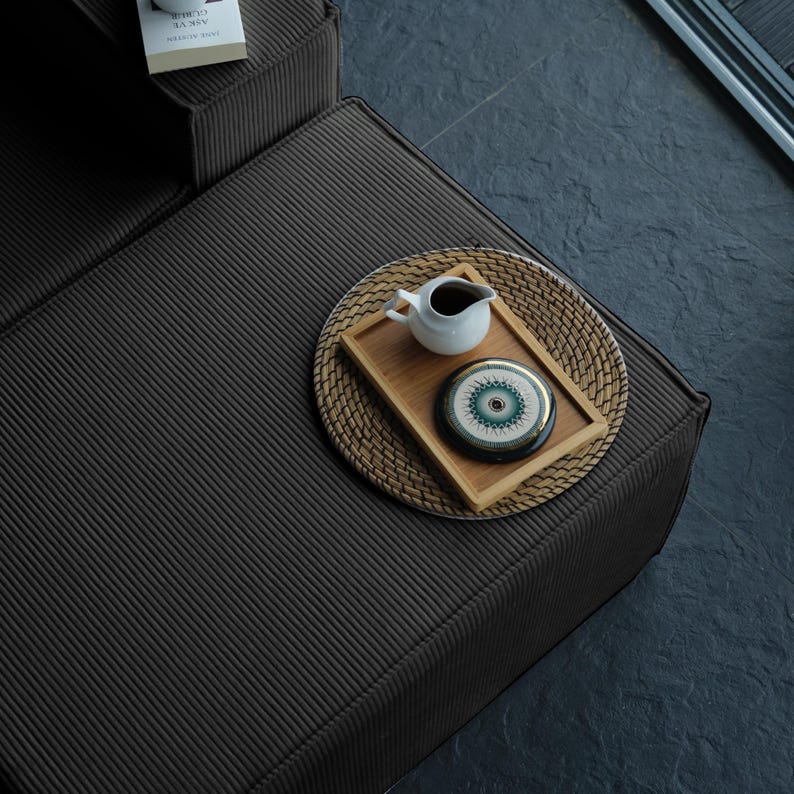 Designed with teddy warmth and modern simplicity, this comfortable floor sofa features washable fabric and soft cushions — perfect for cozying up every day.