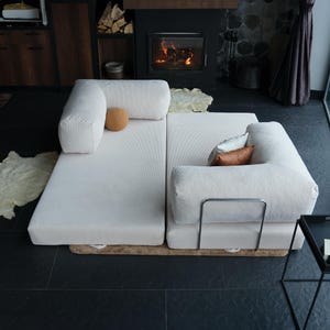 Modular soft teddy sofa shown with foldable cushions, perfect for flexible floor seating that can double as a nap-ready bed or family hangout zone.